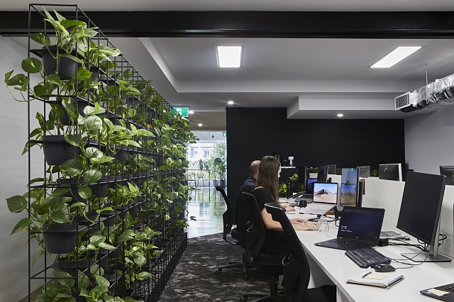 Image of people working at a desk.