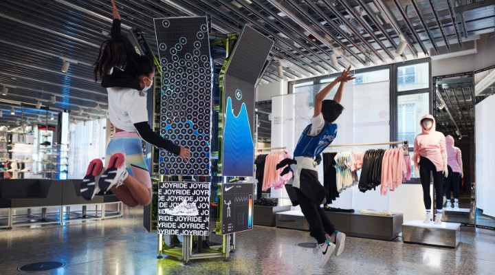 Kids jumping at the Nike House of Innovation store in Paris.