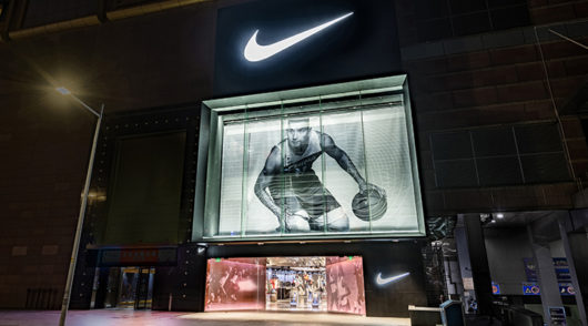 The front of the Nike Rise store featuring a huge image of a basketballer at the front at night.