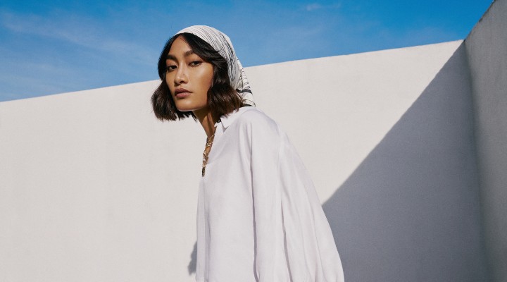An Asian woman wearing a white tencel blouse in a Zalora campaign.