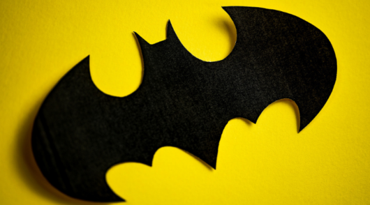 batman logo in yellow background