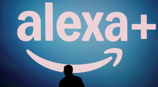 The logo of Amazon's Alexa + is displayed on a screen during an Amazon Devices launch event in New York City, US