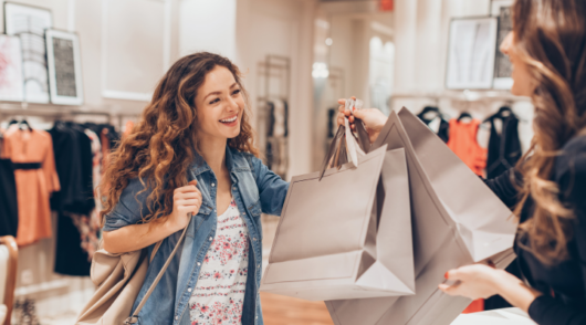 A happy woman shopping with bags
