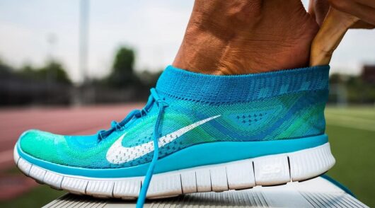 a person puts on Nike shoe