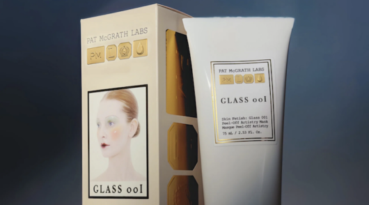 Pat McGrath Labs’ Skin Fetish: Glass 001 Artistry Mask product packaging and face mask.
