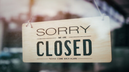 Closed sign in a shop window.