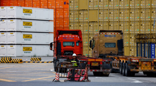 A security personnel stands guard at an entrance to a container logistics centre at the Yantian port in Shenzhen, Guangdong province, China May 9, 2025.