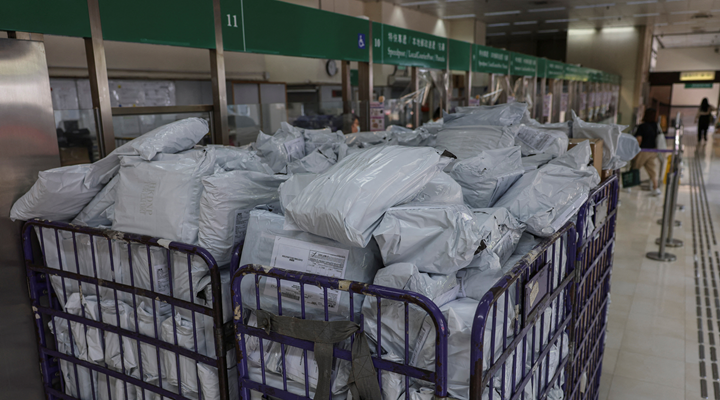 a crate full of soft-sided parcels for online delivery