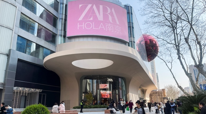 People walk outside a newly opened Zara flagship store in Nanjing, Jiangsu province, China March 20, 2025. REUTERS/Casey Hall