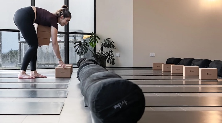 Image of woman in O-Studio yoga room.