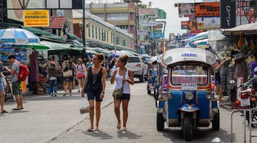 Overseas tourists walk along Khao San Road in Bangkok Thailand