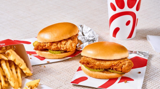 a photo of chicken sandwiches and a branded cup from chick-fil-a