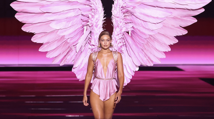 Victoria’s Secret angel Gigi Hadid walking down the runway wearing a pair of wings.