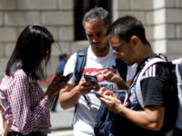 People looking at their phones in Manhattan