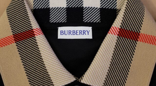 A Burberry Check styled shirt with the Burberry label is displayed at the Burberry flagship store