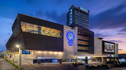 SM City mall exterior at dusk.