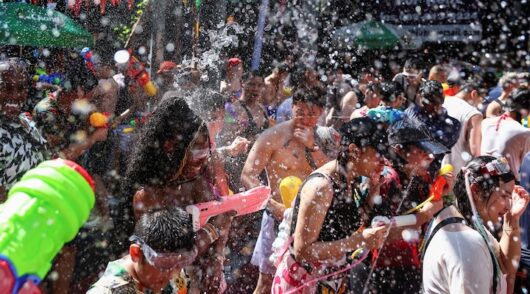 Revellers play with water as they celebrate the Songkran holiday