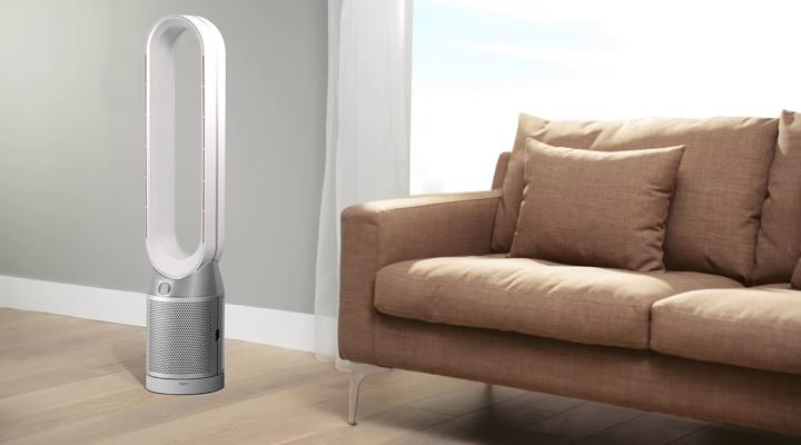 Dyson air purifier beside sofa.