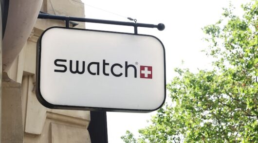 The logo of Swiss watch manufacturer Swatch is displayed outside a store