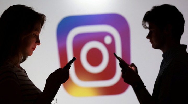 Instagram logo and smartphone users.