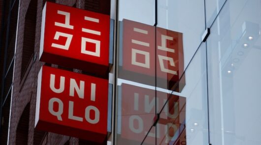 Fast Retailing's Uniqlo sign boards are displayed at a casual clothing store in Tokyo