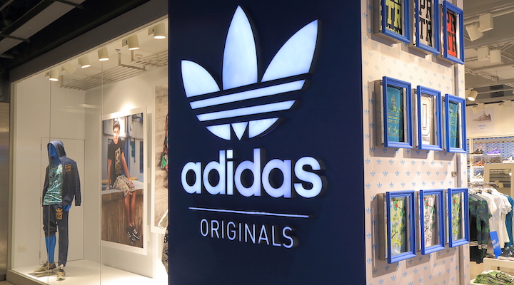 An exterior shot of an Adidas storefront.