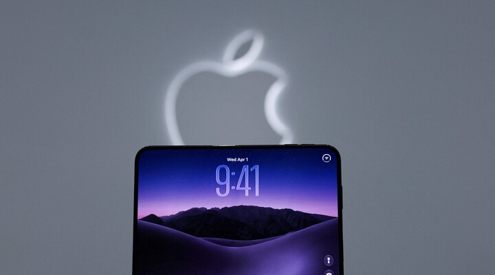Apple device beneath the company logo.
