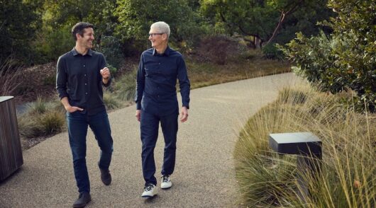 Apple CEO John Ternus standing alongside former CEO Tim Cook.