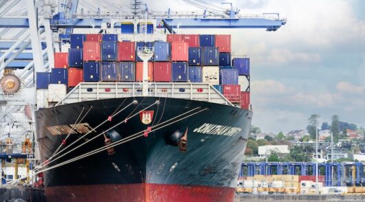A large cargo ship docked at Auckland Port, New Zealand.