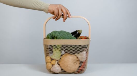a basket filled with fresh vegetables
