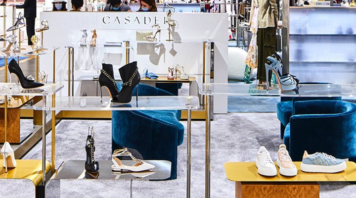 Designer shoes on display in a department store.