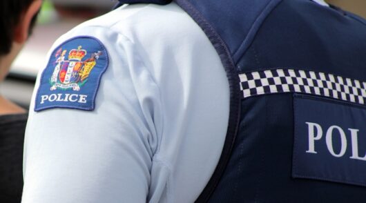 Close up of a New Zealand police officer's uniform and badge
